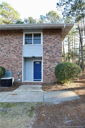 a front view of a house with garage