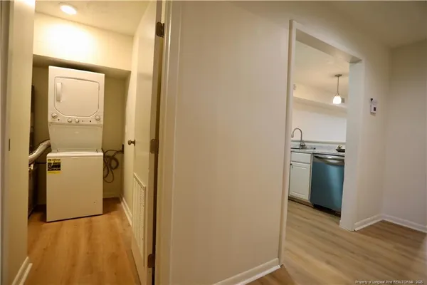 a view of a bathroom with a sink and a mirror