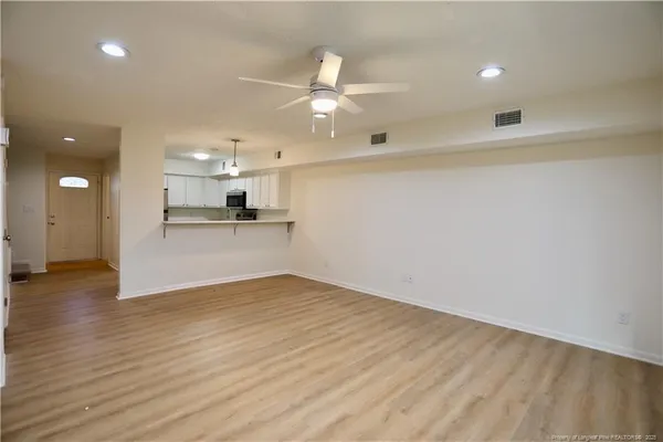 a view of a kitchen with a sink and a window