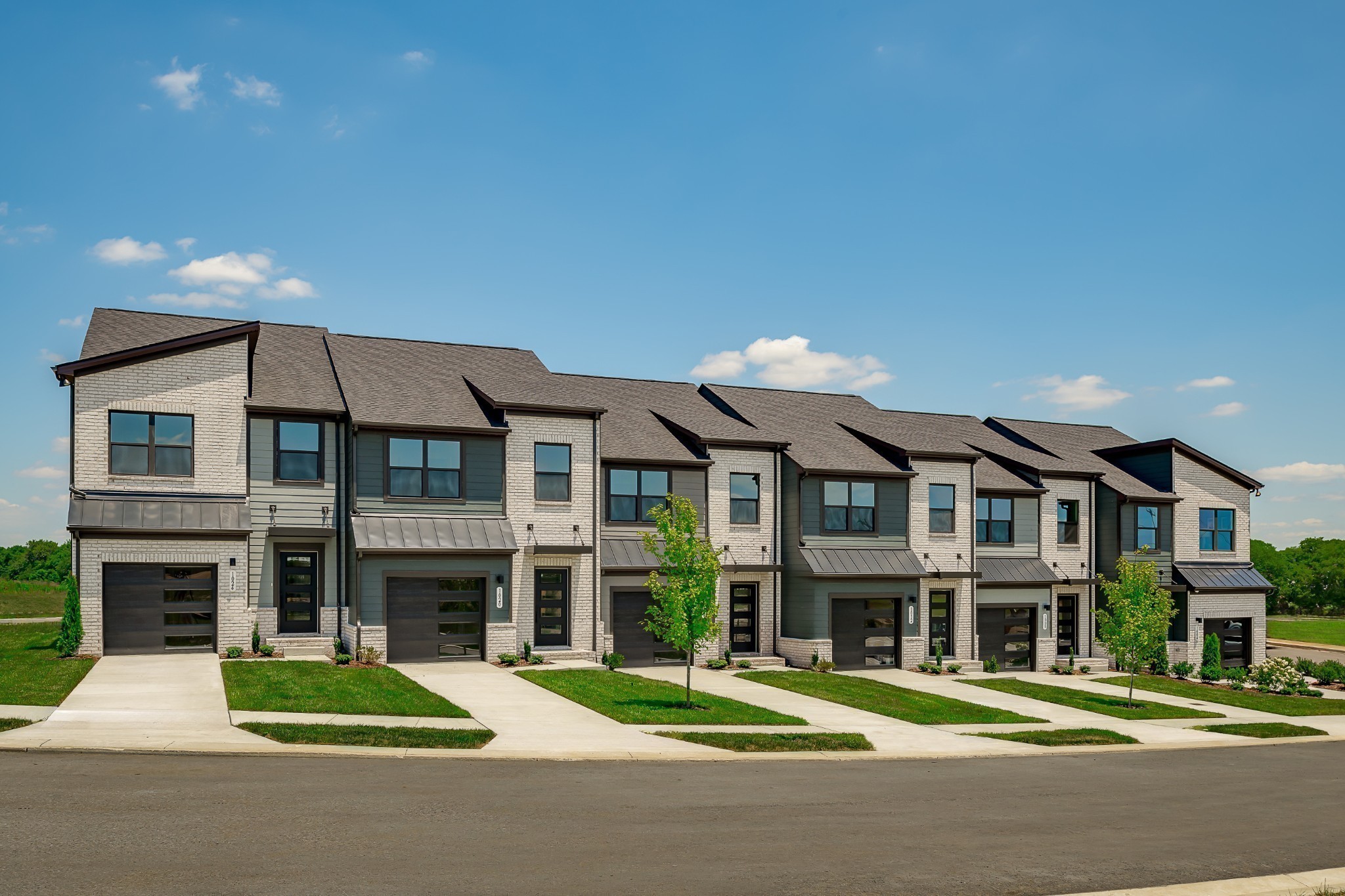 1013 Riverbrook Drive Gallatin, TN 37066 - Photo 1 of 30 a front view of a building with a garden