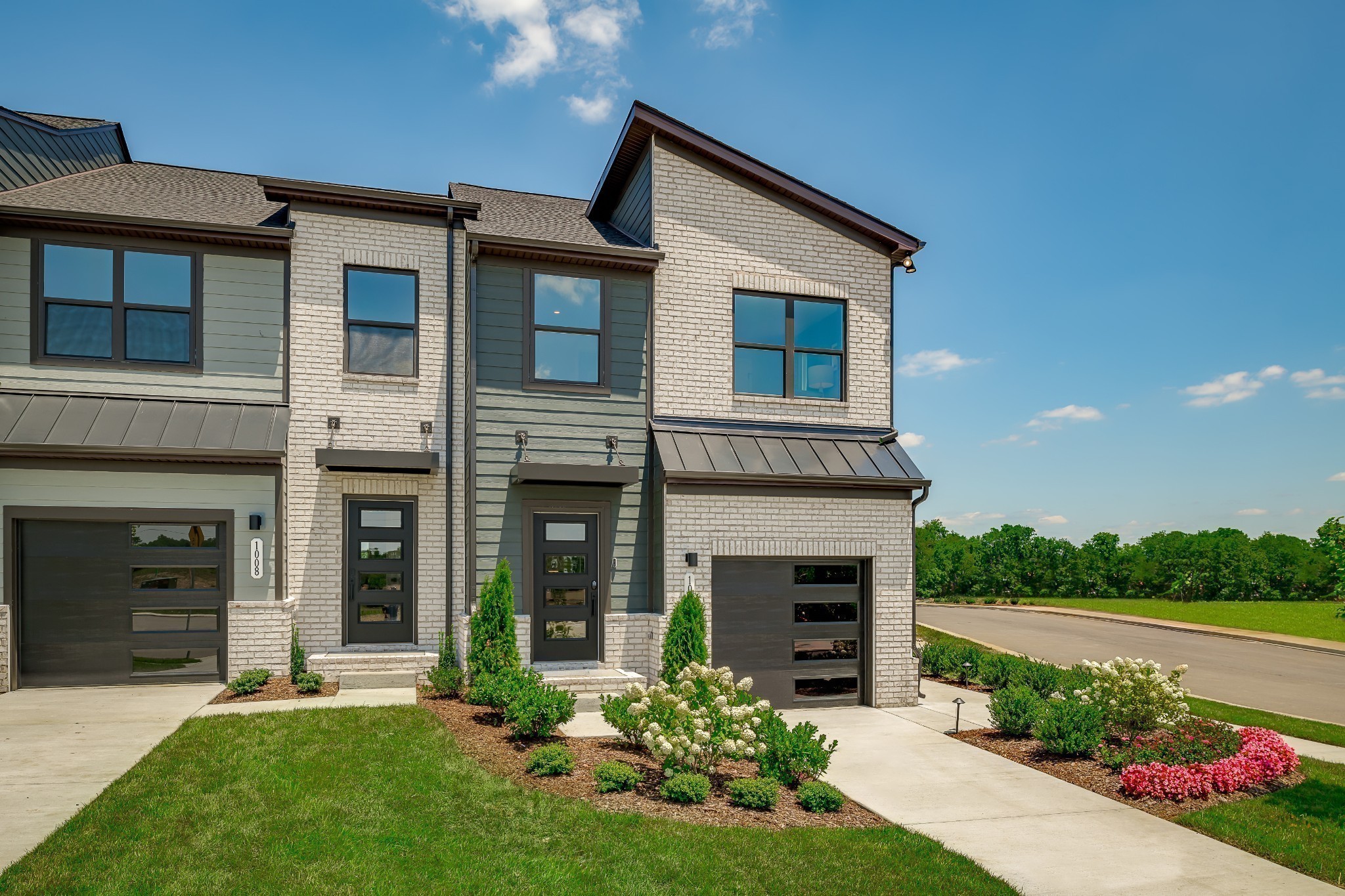 1013 Riverbrook Drive Gallatin, TN 37066 - Photo 3 of 30 a front view of a house with a yard and garage