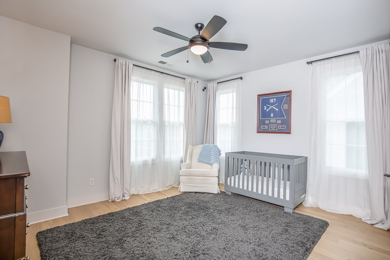 1202 Parkview Circle Nashville, TN 37204 - Photo 14 of 30 a living room with a baby crib furniture and a window