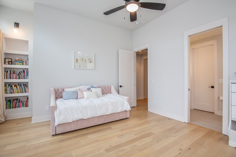 1202 Parkview Circle Nashville, TN 37204 - Photo 18 of 30 a bedroom with a large bed and a chandelier