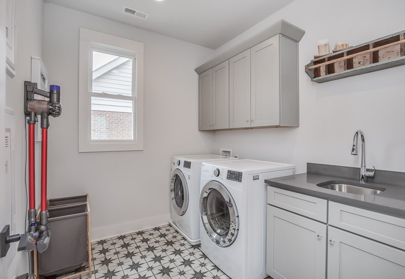 1202 Parkview Circle Nashville, TN 37204 - Photo 25 of 30 a utility room with sink dryer and washer