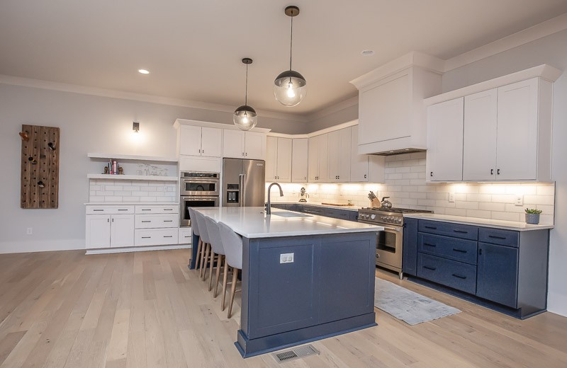 1202 Parkview Circle Nashville, TN 37204 - Photo 6 of 30 a kitchen with kitchen island a stove a refrigerator a sink dishwasher with a dining table and chairs