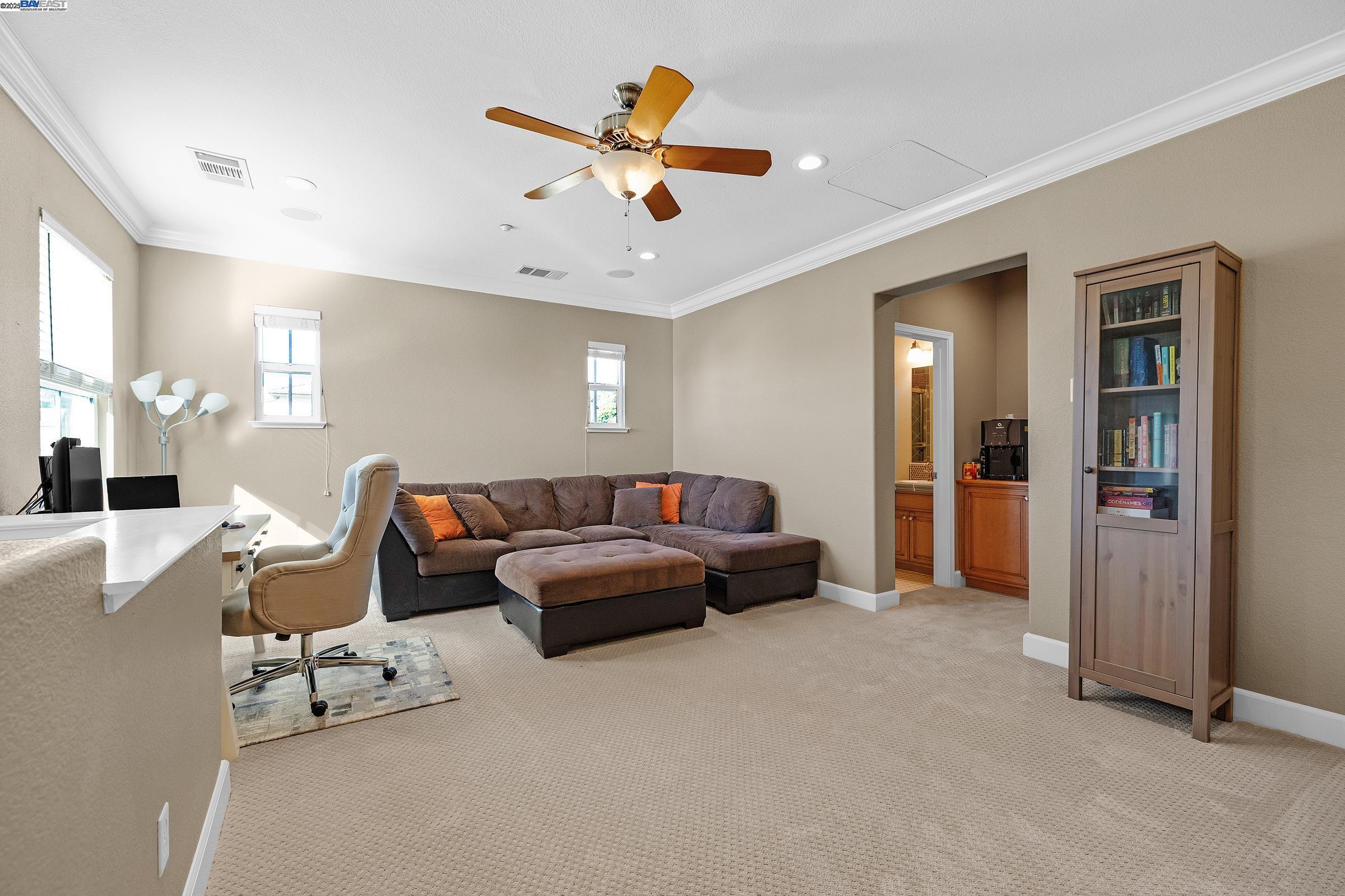 588 Dovecote Lane, Unit 4 Livermore, CA 94551 - Photo 16 of 21 a living room with furniture and a chandelier