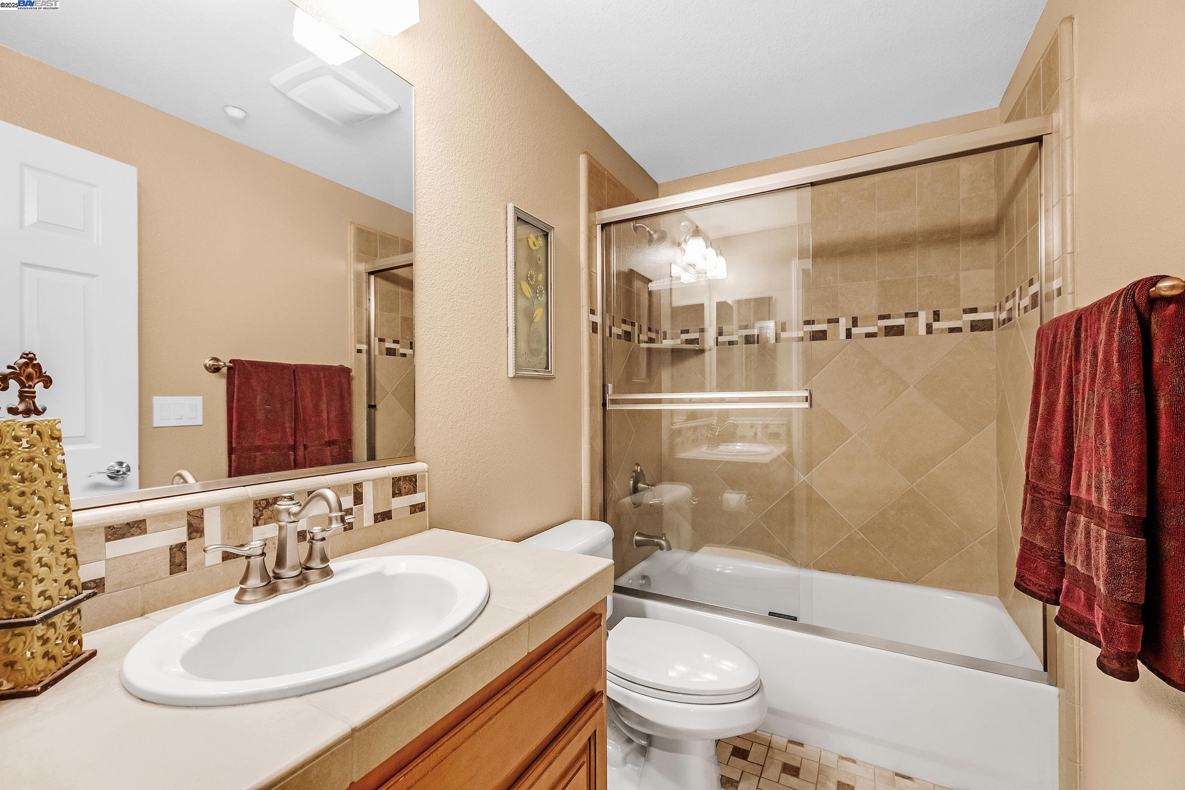 588 Dovecote Lane, Unit 4 Livermore, CA 94551 - Photo 10 of 21 a bathroom with a sink toilet and shower
