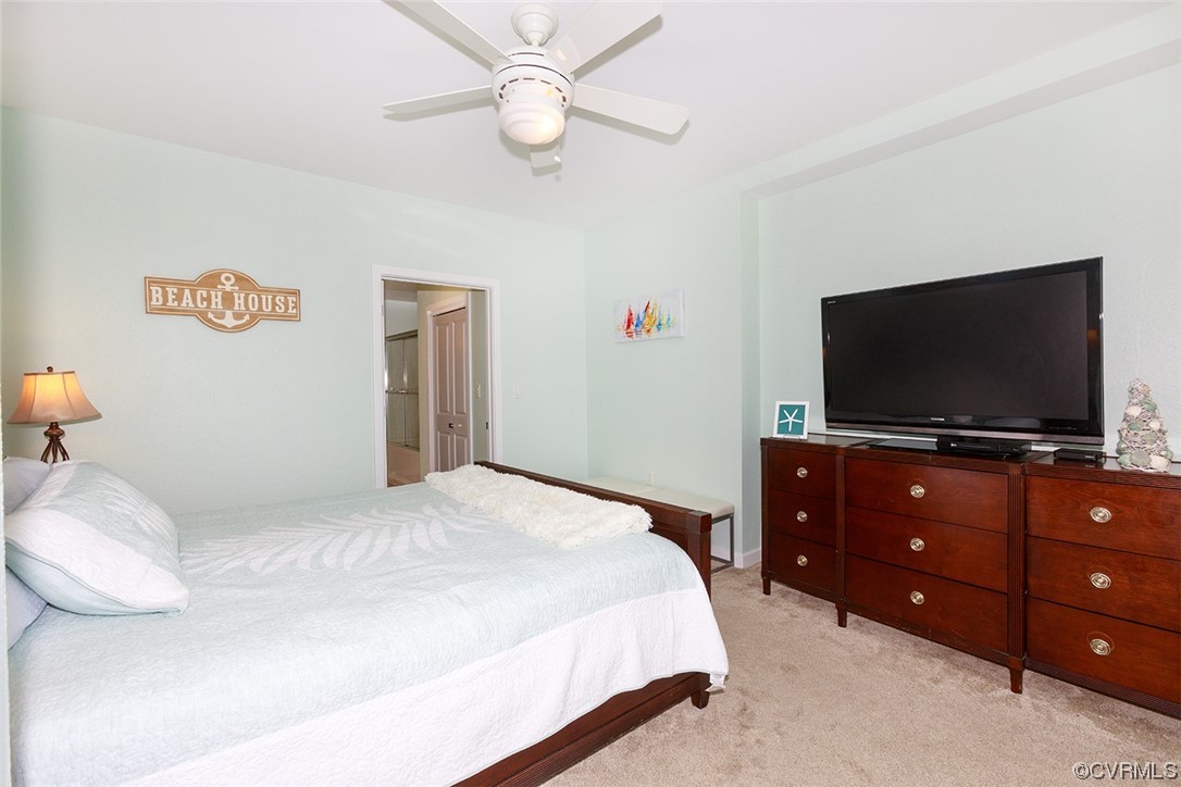 3738 Sandpiper Road, Unit 108B Virginia Beach, VA 23456 - Photo 17 of 31 a bedroom with a bed and a flat screen tv