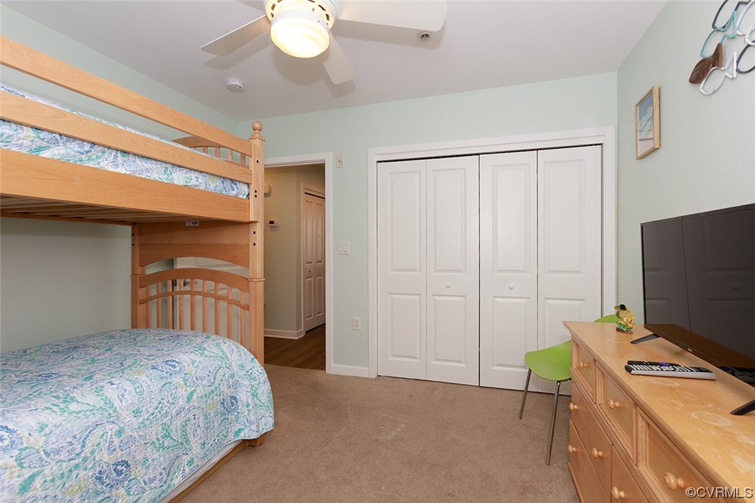 3738 Sandpiper Road, Unit 108B Virginia Beach, VA 23456 - Photo 20 of 31 a bedroom with a bed and a flat tv screen