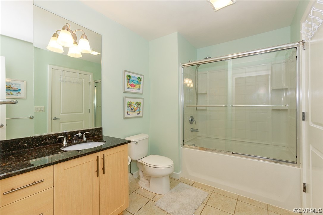 3738 Sandpiper Road, Unit 108B Virginia Beach, VA 23456 - Photo 21 of 31 a bathroom with a granite countertop sink a toilet and shower