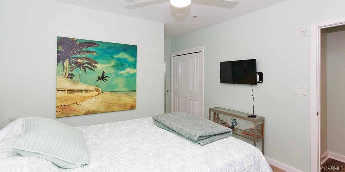 3738 Sandpiper Road, Unit 108B Virginia Beach, VA 23456 - Photo 22 of 31 a bedroom with a bed and a flat screen tv