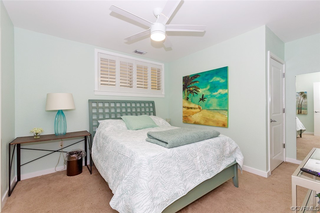 3738 Sandpiper Road, Unit 108B Virginia Beach, VA 23456 - Photo 23 of 31 a bedroom with a bed table and a window