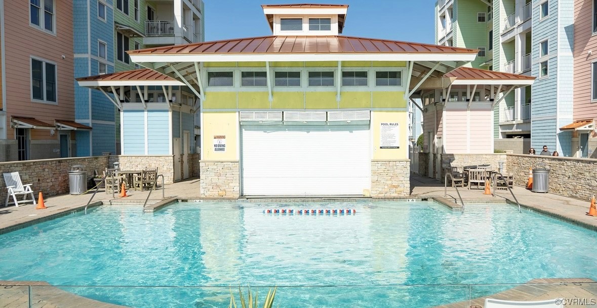 3738 Sandpiper Road, Unit 108B Virginia Beach, VA 23456 - Photo 26 of 31 a front view of a building with outdoor area
