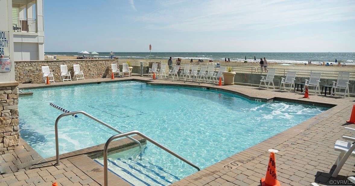 3738 Sandpiper Road, Unit 108B Virginia Beach, VA 23456 - Photo 27 of 31 a view of a swimming pool with outdoor seating