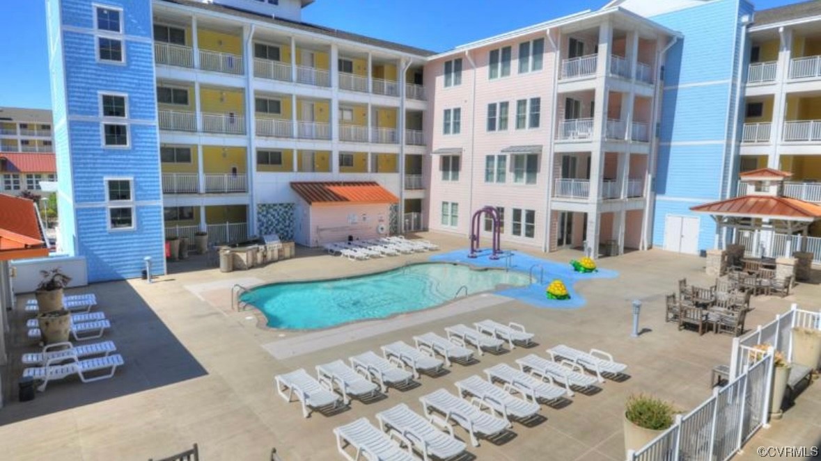 3738 Sandpiper Road, Unit 108B Virginia Beach, VA 23456 - Photo 28 of 31 a front view of a building with outdoor space