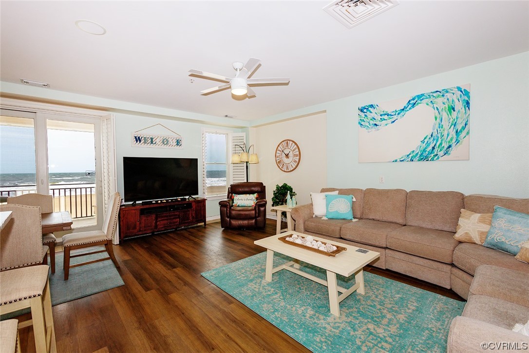 3738 Sandpiper Road, Unit 108B Virginia Beach, VA 23456 - Photo 9 of 31 a living room with furniture a flat screen tv and a window