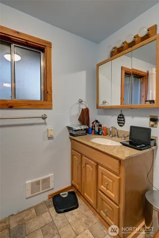 a kitchen with a stove a sink and a microwave