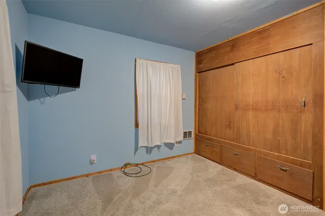 a view of a room with an empty space