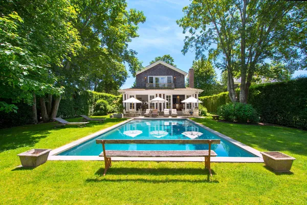 a view of swimming pool with a yard