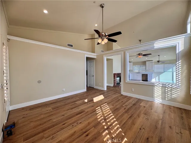 a view of livingroom with hardwood floor and a ceiling fan