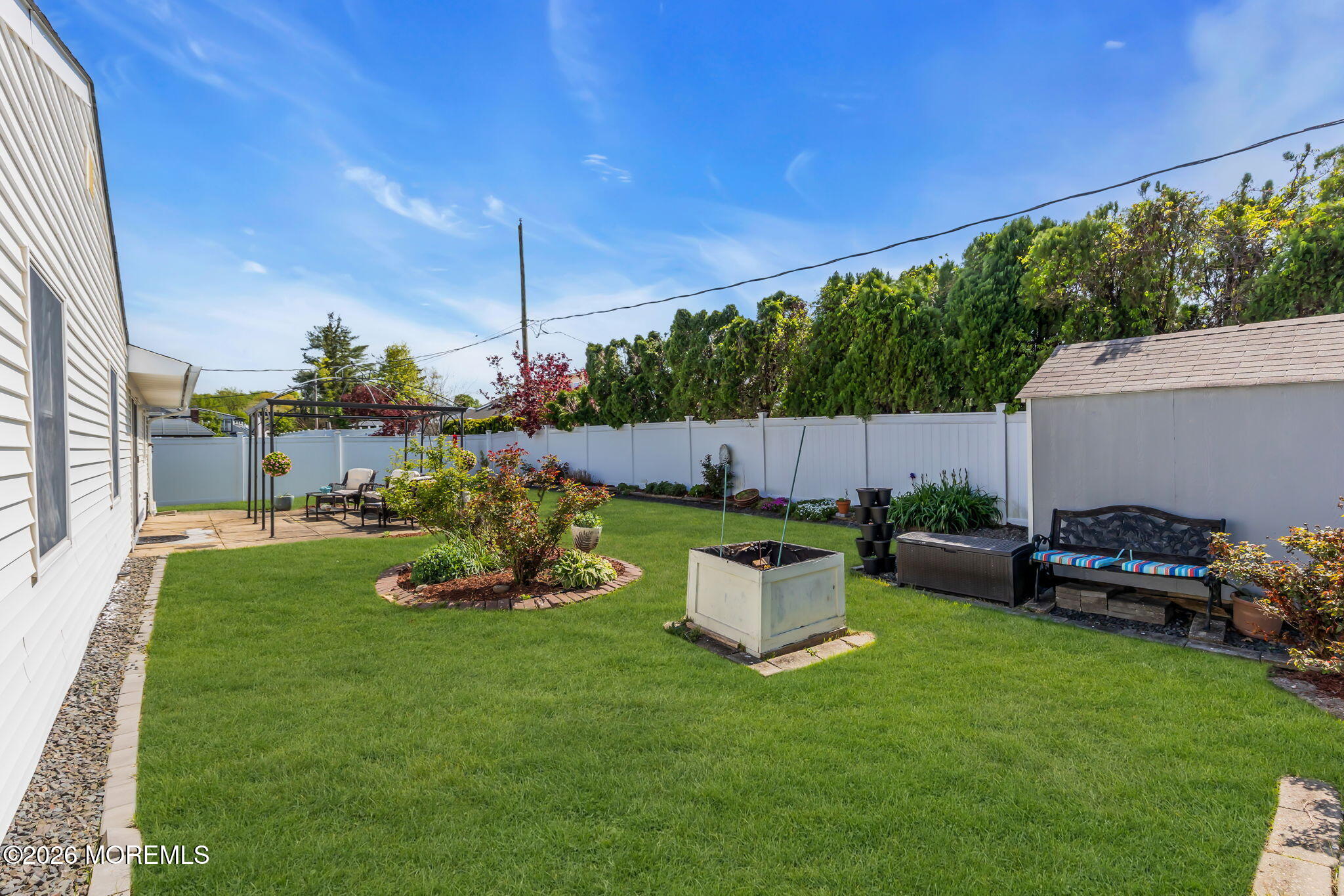 101 Andover Lane Matawan, NJ 07747 - Photo 51 of 51 a view of a house with backyard sitting area and garden