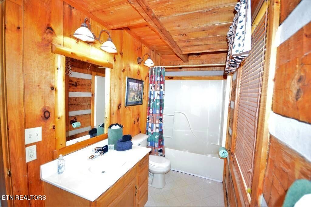 2165 Rising Fawn Way Sevierville, TN 37862 - Photo 12 of 24 a bathroom with a sink mirror toilet and shower
