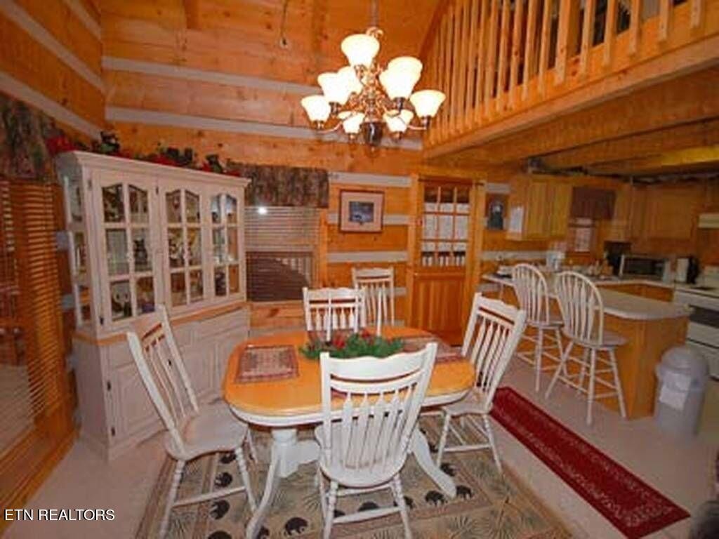 2165 Rising Fawn Way Sevierville, TN 37862 - Photo 3 of 24 a view of a dining room with furniture and chandelier
