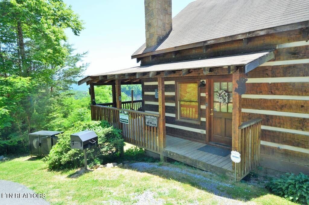 2165 Rising Fawn Way Sevierville, TN 37862 - Photo 7 of 24 a view of a porch with a wooden door