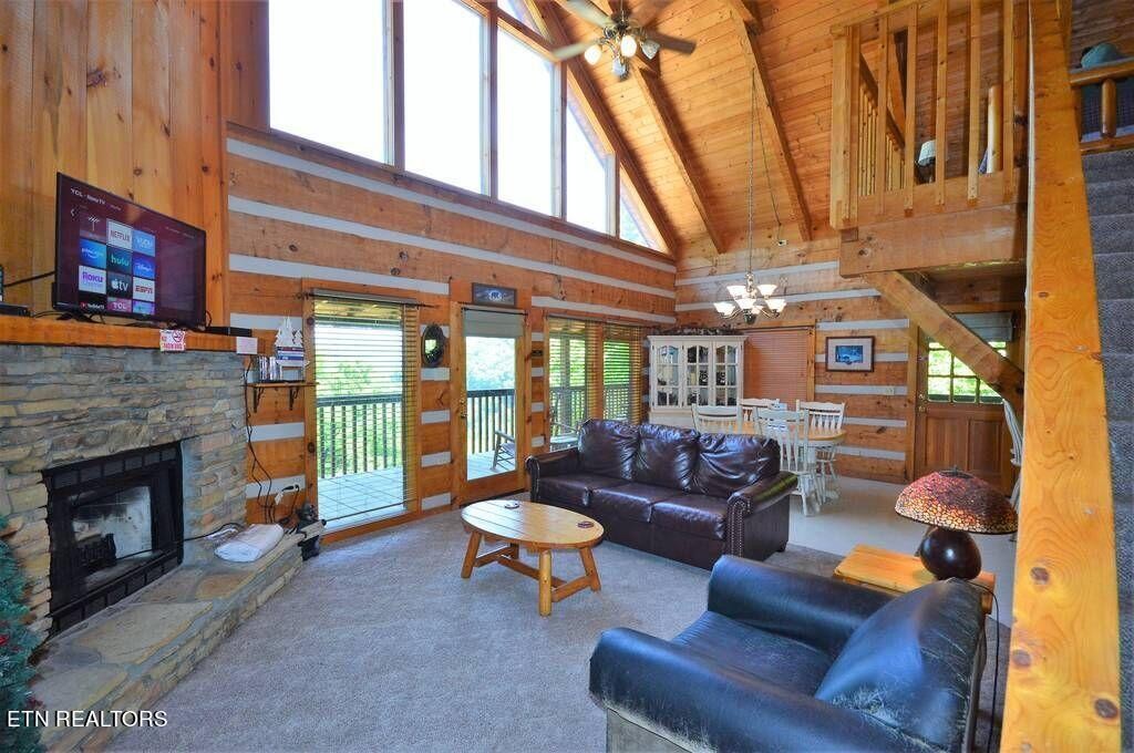 2165 Rising Fawn Way Sevierville, TN 37862 - Photo 8 of 24 a living room with furniture and a fireplace