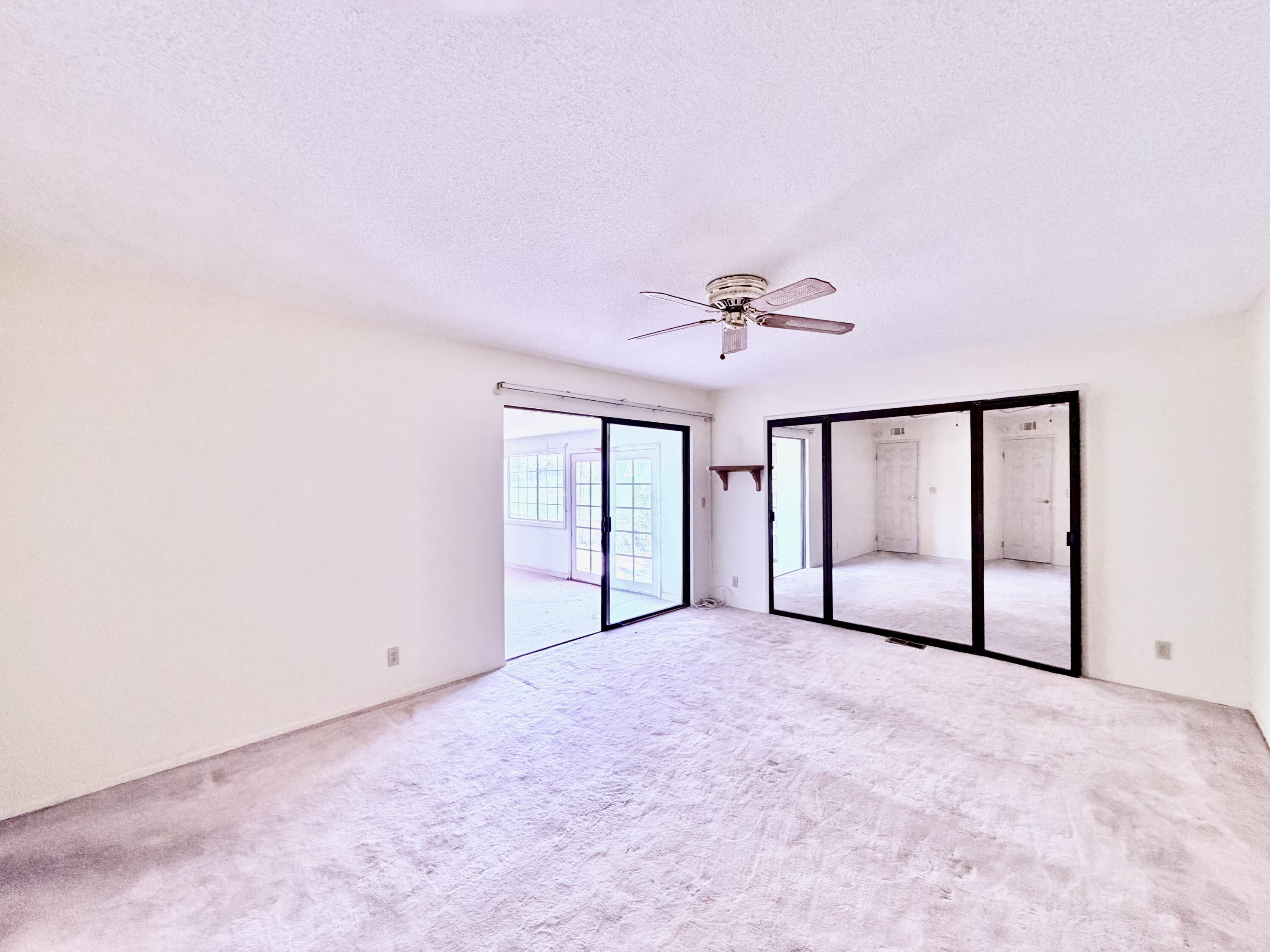 74361 Angel Camp Road Palm Desert, CA 92260 - Photo 9 of 12 a view of an empty room with a window