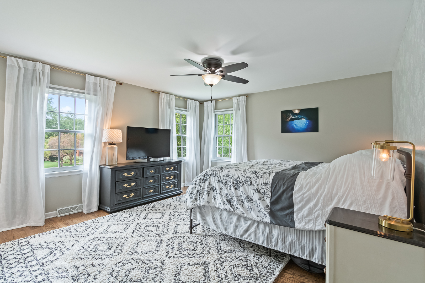 265 Cold Spring Road Barrington, IL 60010 - Photo 17 of 43 a bedroom with a bed and a flat screen tv