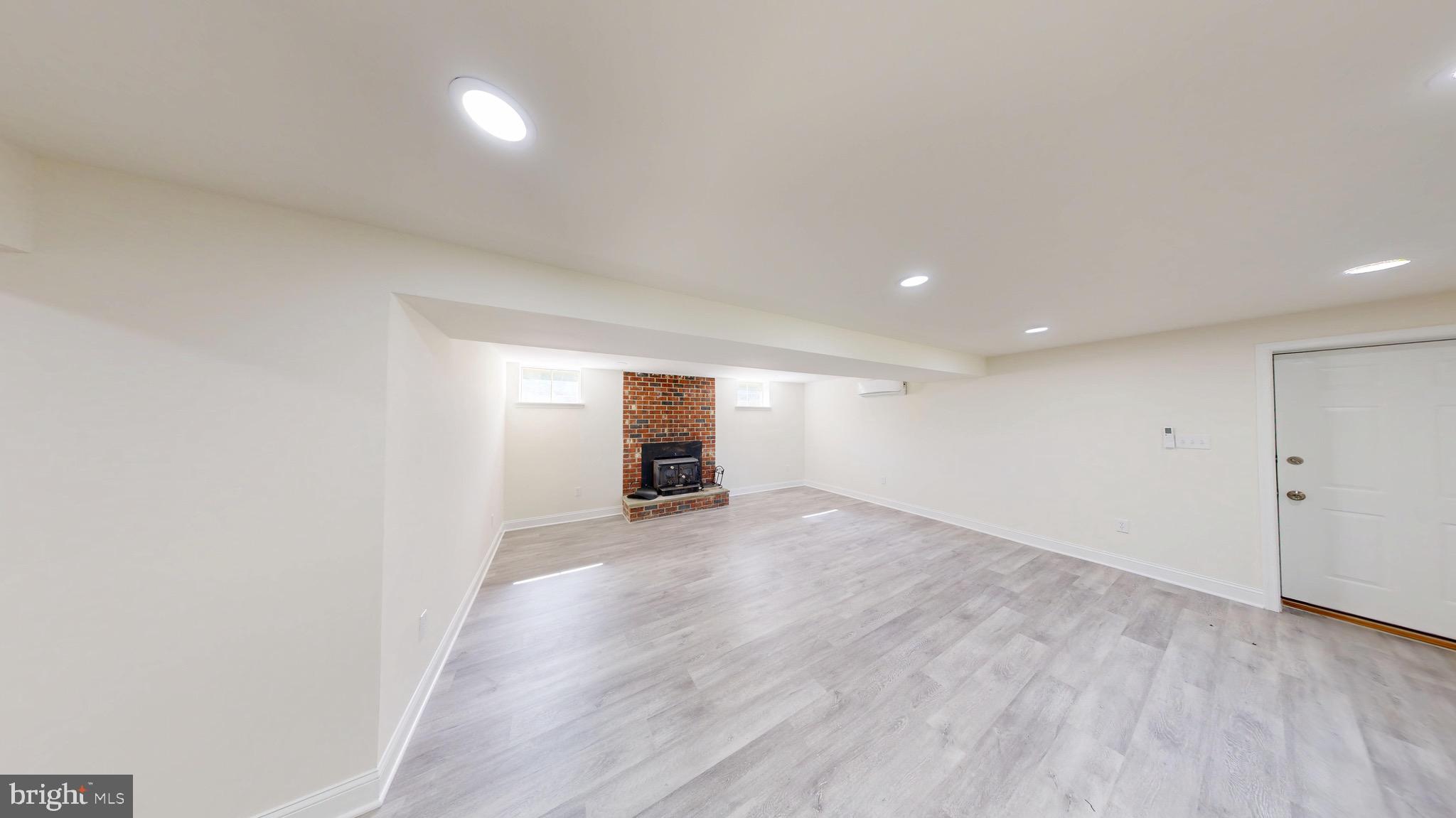 729 West Watersville Road Mount Airy, MD 21771 - Photo 30 of 42 an empty room with wooden floor and windows