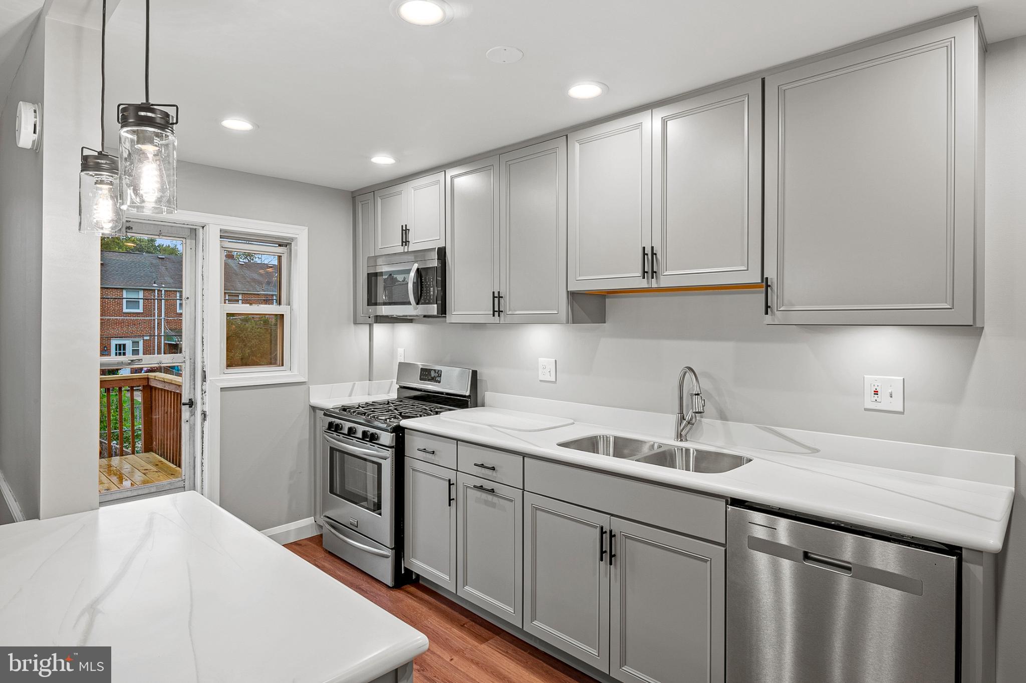 1621 Thetford Road Towson, MD 21286 - Photo 10 of 31 a kitchen with stainless steel appliances granite countertop a sink stove and refrigerator