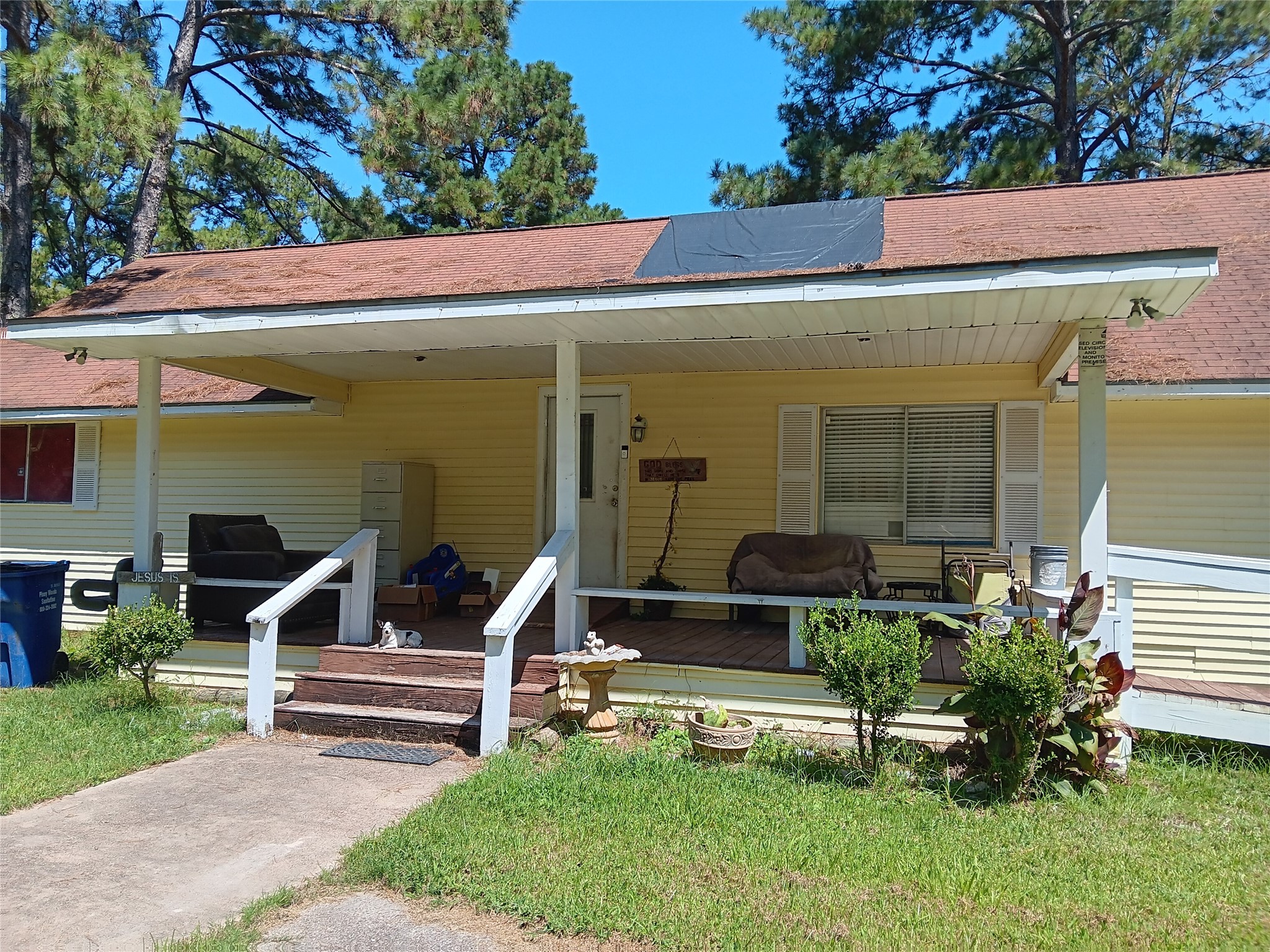 420 Mangum Road Livingston, TX 77351 - Photo 8 of 36 Large porch on front of house. Roof needs some repair.