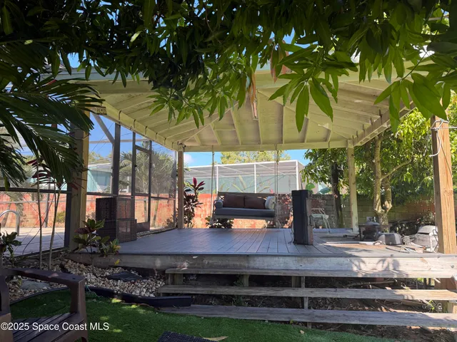 a view of a chairs and table in the patio