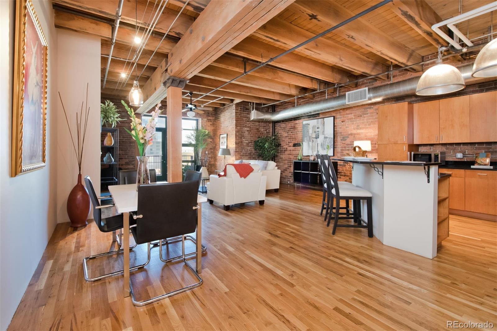 1801 Wynkoop Street, Unit 418 Denver, CO 80202 - Photo 14 of 35 a living room with furniture and a wooden floor