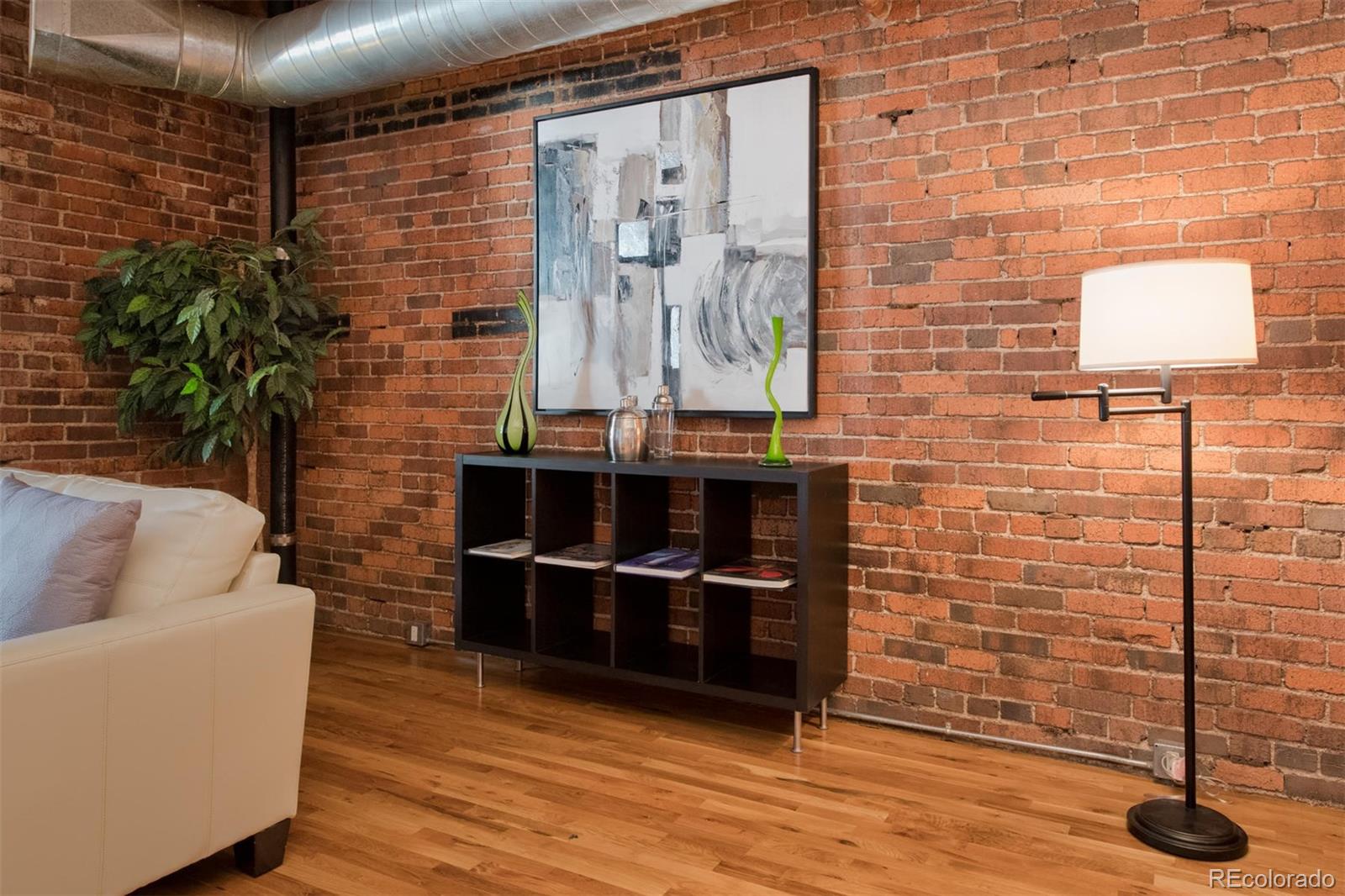 1801 Wynkoop Street, Unit 418 Denver, CO 80202 - Photo 15 of 35 a living room with furniture