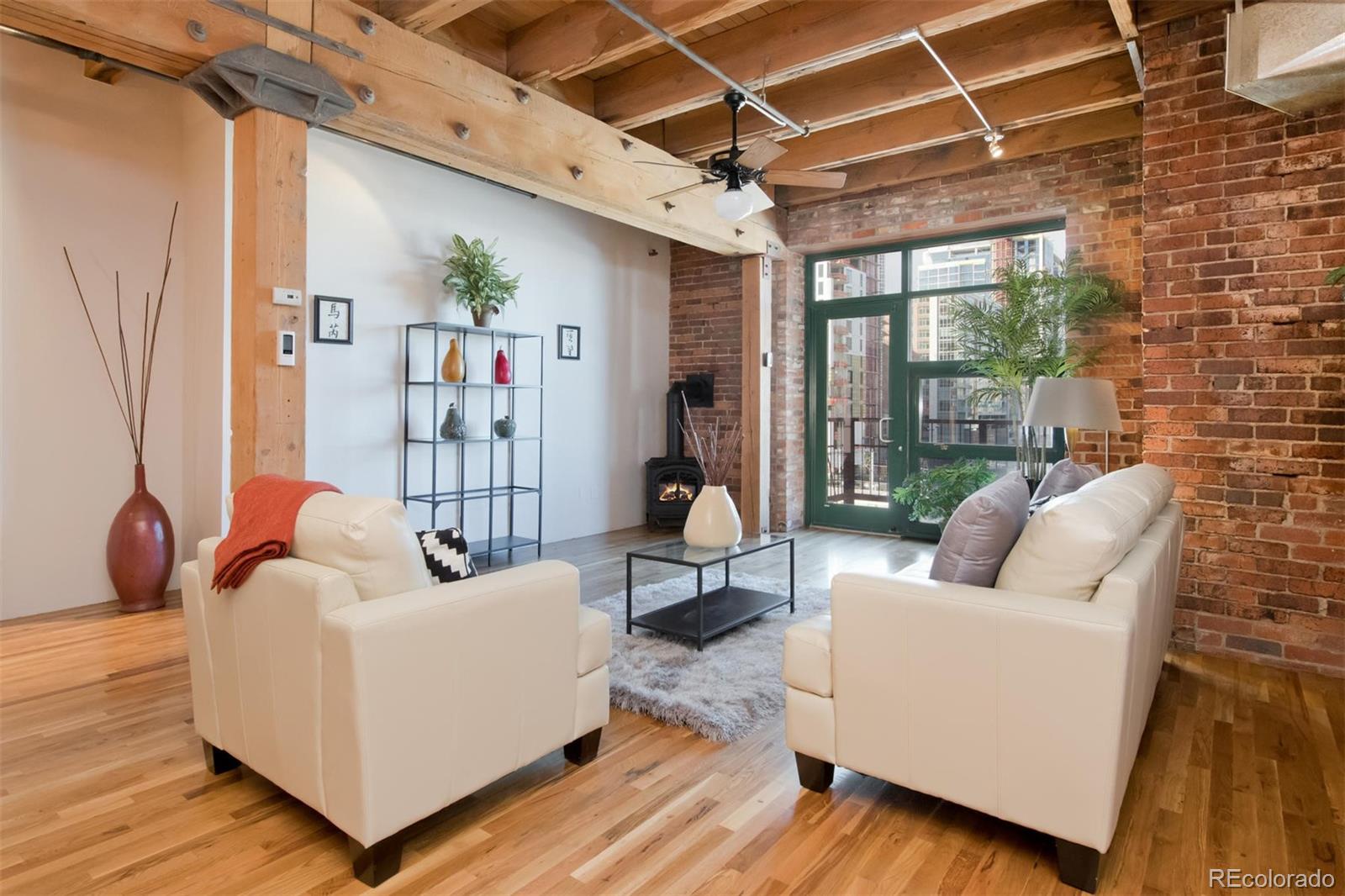 1801 Wynkoop Street, Unit 418 Denver, CO 80202 - Photo 16 of 35 a living room with furniture and a large window