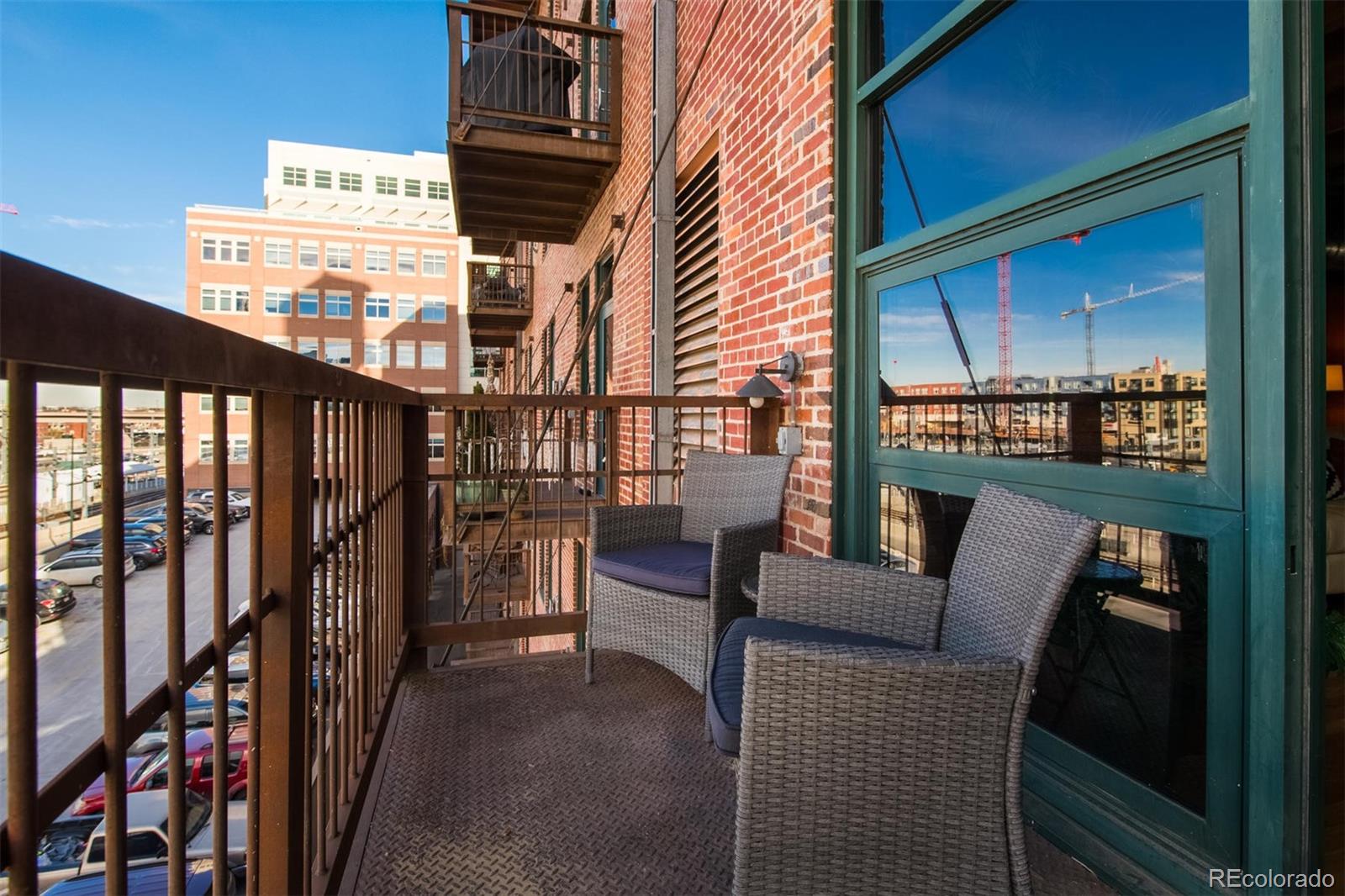 1801 Wynkoop Street, Unit 418 Denver, CO 80202 - Photo 24 of 35 a view of a balcony with chairs