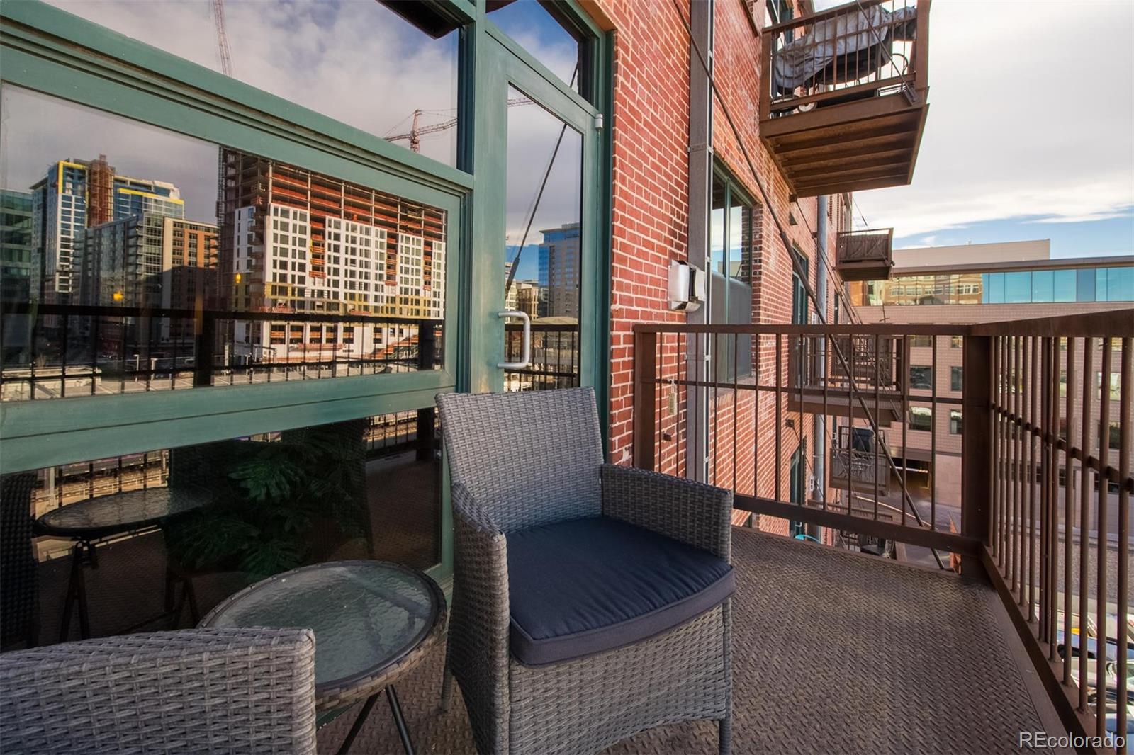 1801 Wynkoop Street, Unit 418 Denver, CO 80202 - Photo 25 of 35 a view of a chairs and table in the balcony