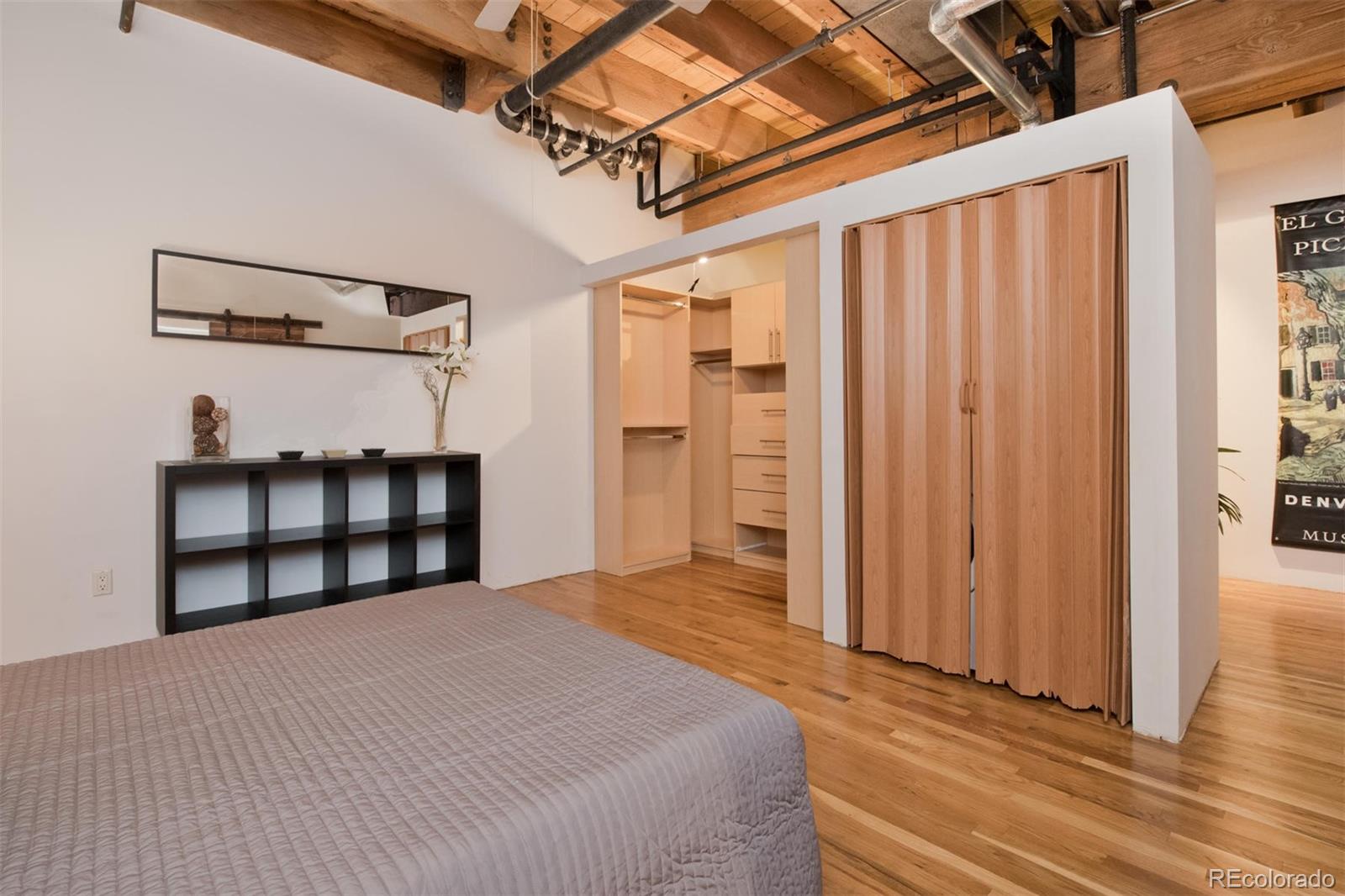 1801 Wynkoop Street, Unit 418 Denver, CO 80202 - Photo 28 of 35 a bedroom with a bed and a table