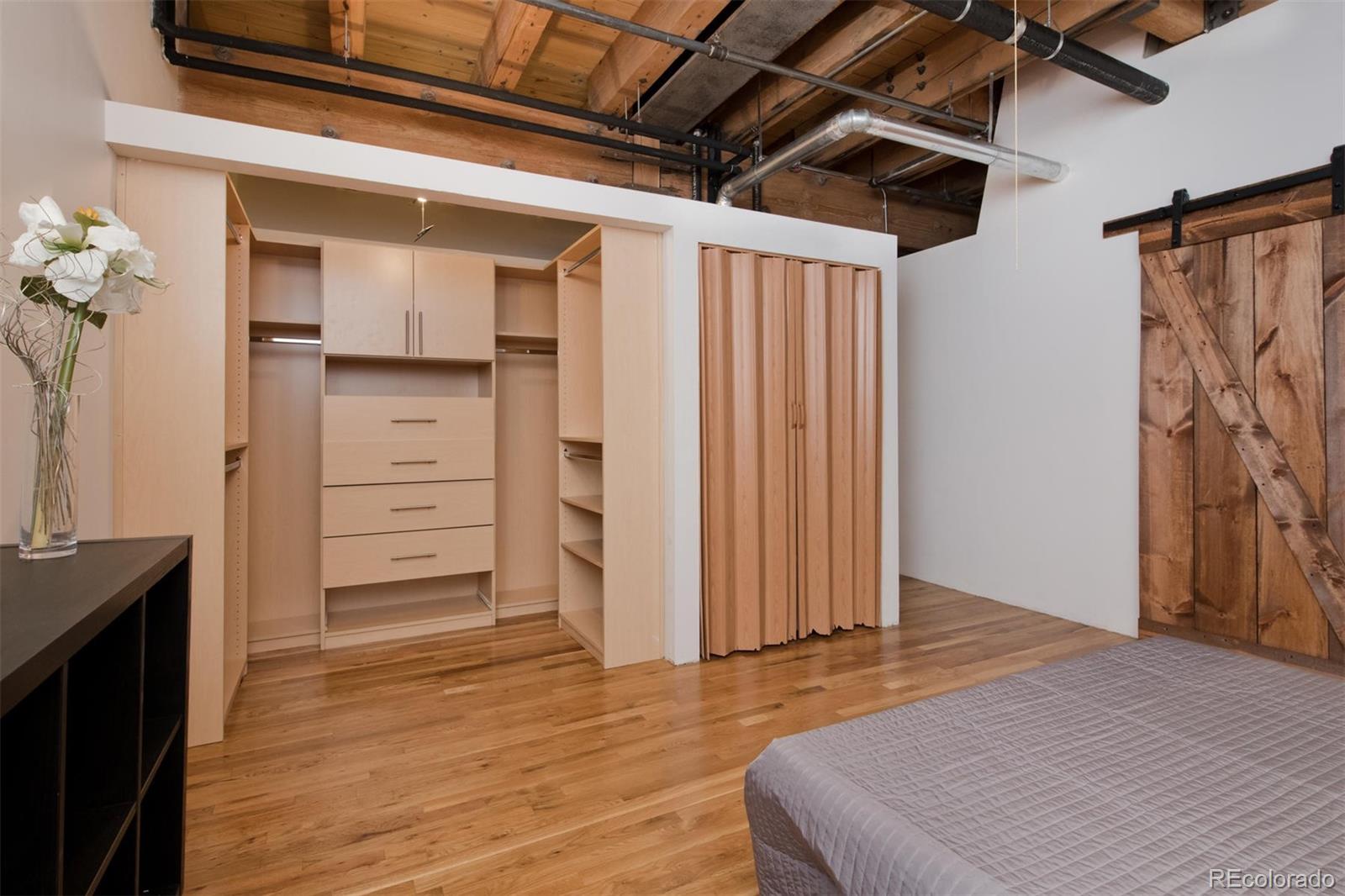 1801 Wynkoop Street, Unit 418 Denver, CO 80202 - Photo 31 of 35 a view of walk in closet with clothes and shoes
