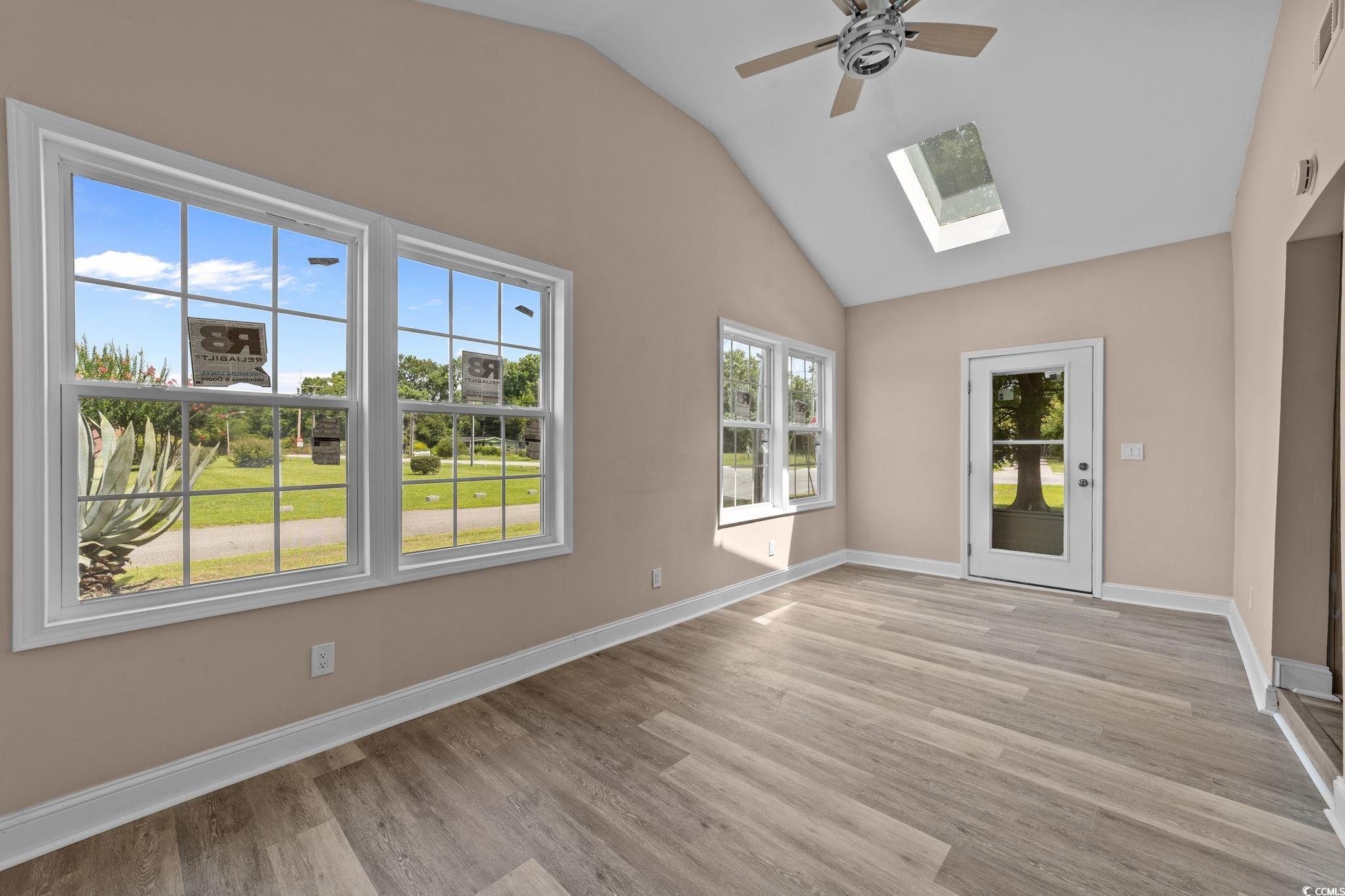 1821 Hawkins Street Georgetown, SC 29440 - Photo 23 of 40 Unfurnished room with a ceiling fan, a skylight, lofted ceiling, and light wood finished floors