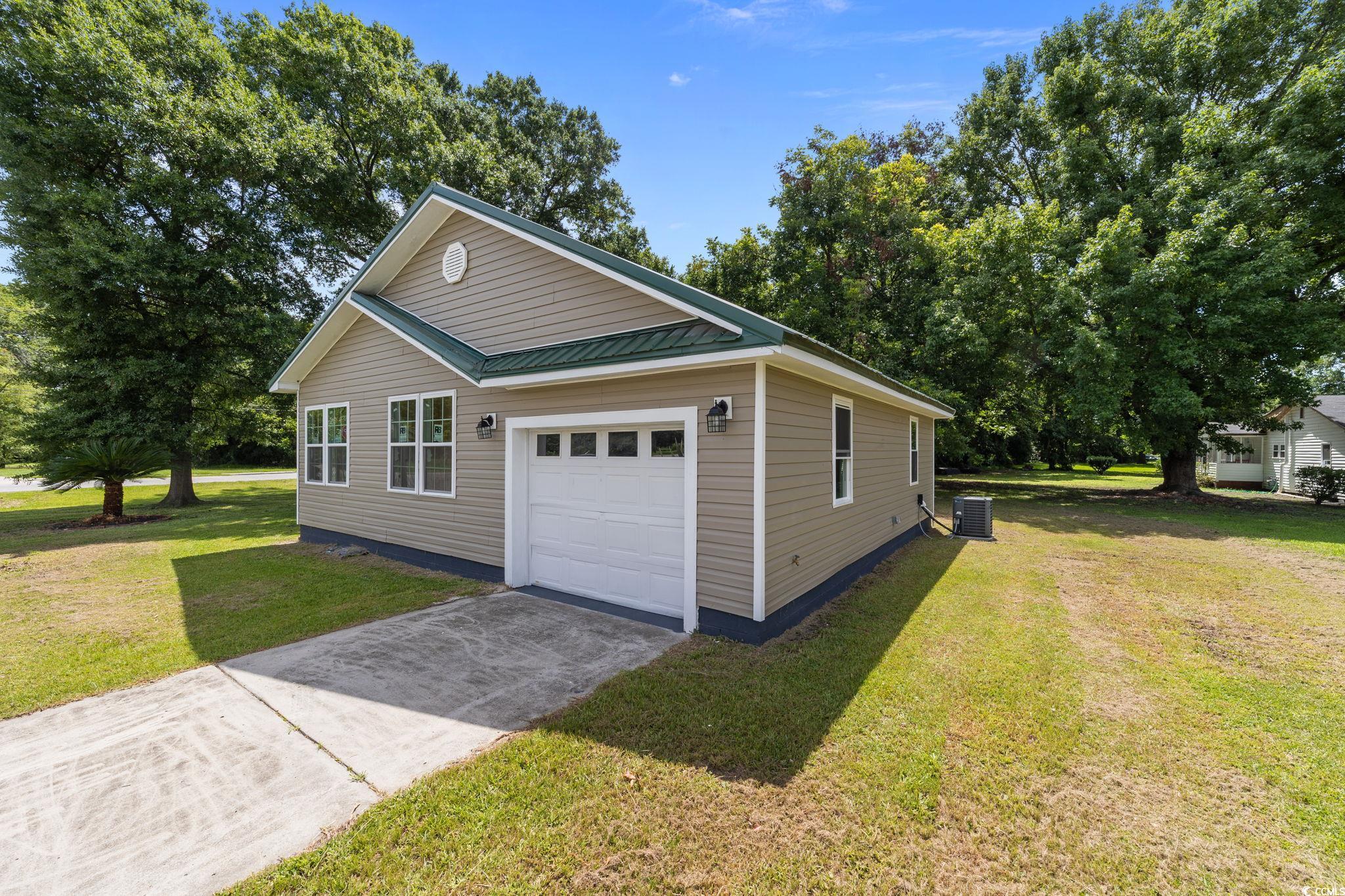 1821 Hawkins Street Georgetown, SC 29440 - Photo 3 of 40 Garage with concrete driveway