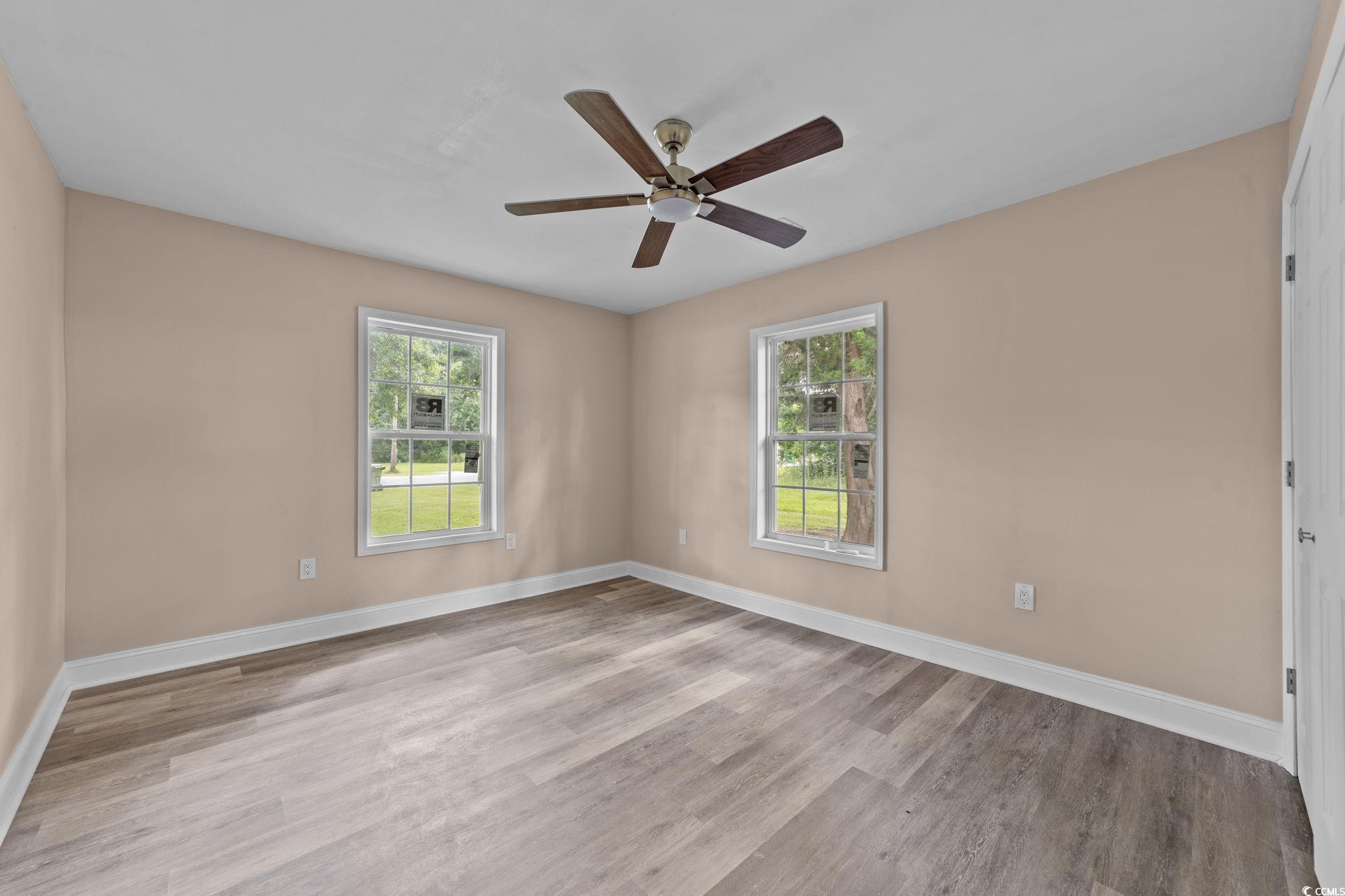 1821 Hawkins Street Georgetown, SC 29440 - Photo 30 of 40 Unfurnished room featuring wood finished floors and a ceiling fan