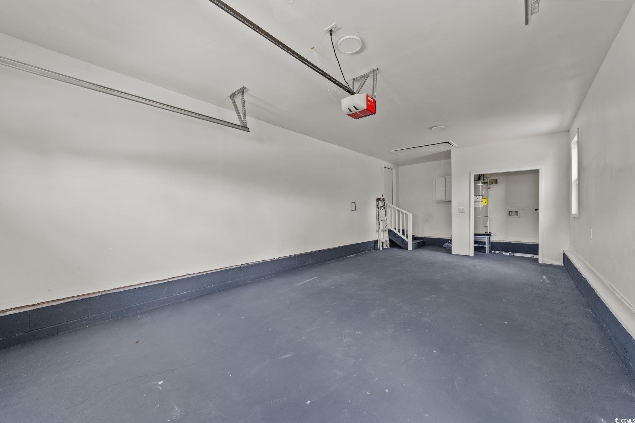 1821 Hawkins Street Georgetown, SC 29440 - Photo 37 of 40 Garage with water heater and a garage door opener