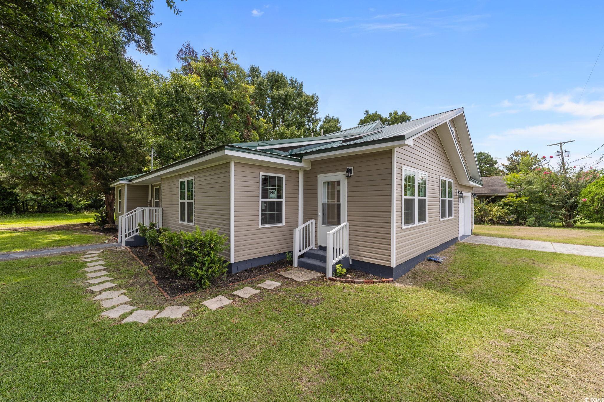 1821 Hawkins Street Georgetown, SC 29440 - Photo 5 of 40 View of front of home featuring a front lawn and a metal roof