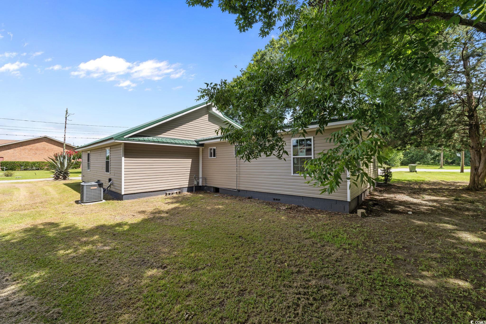 1821 Hawkins Street Georgetown, SC 29440 - Photo 10 of 40 View of property exterior featuring crawl space and a yard