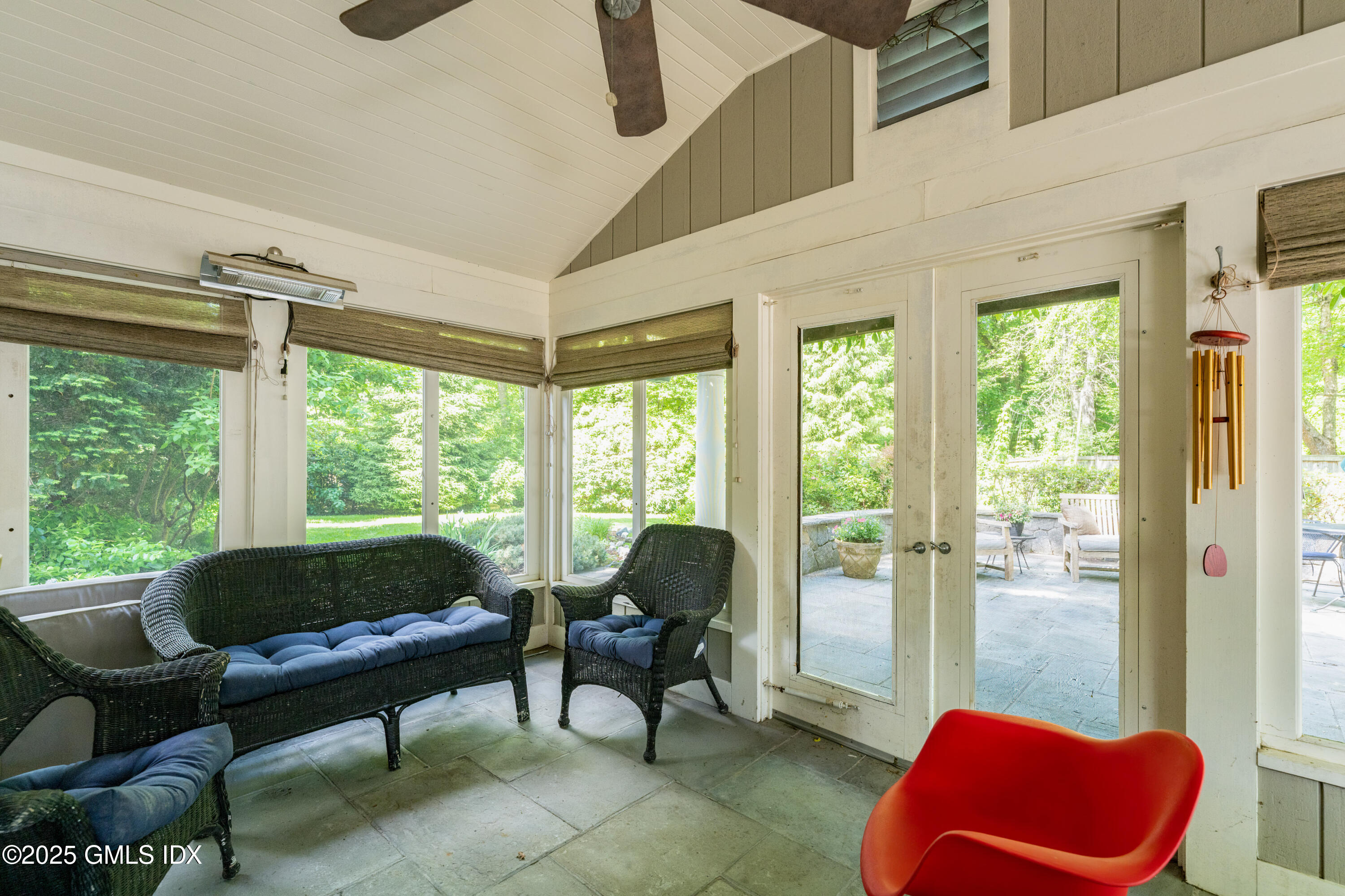 76 Sinawoy Road Cos Cob, CT 06807 - Photo 17 of 23 a living room with furniture and a floor to ceiling window