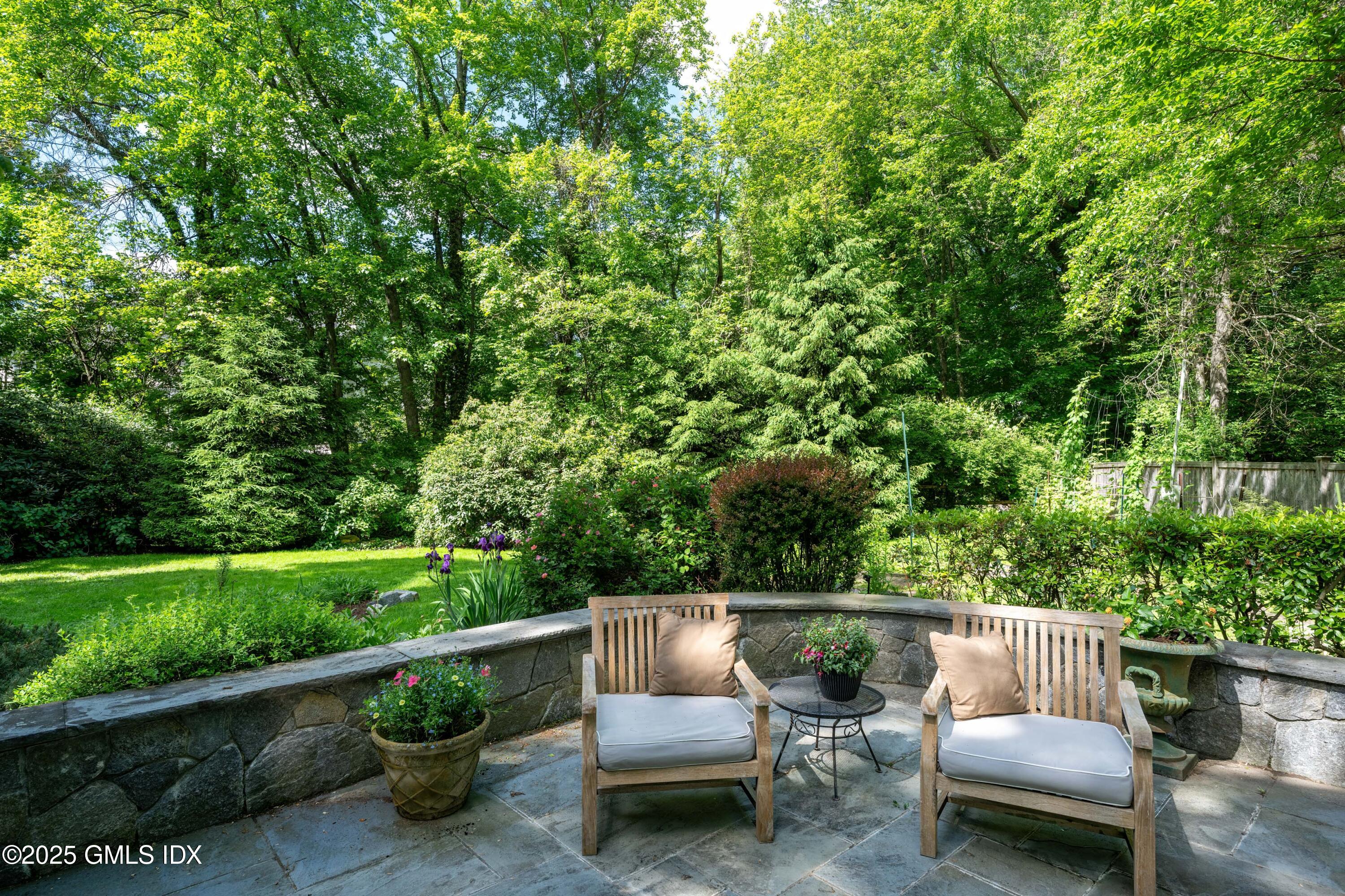 76 Sinawoy Road Cos Cob, CT 06807 - Photo 18 of 23 a view of a patio with couches chairs and potted plants